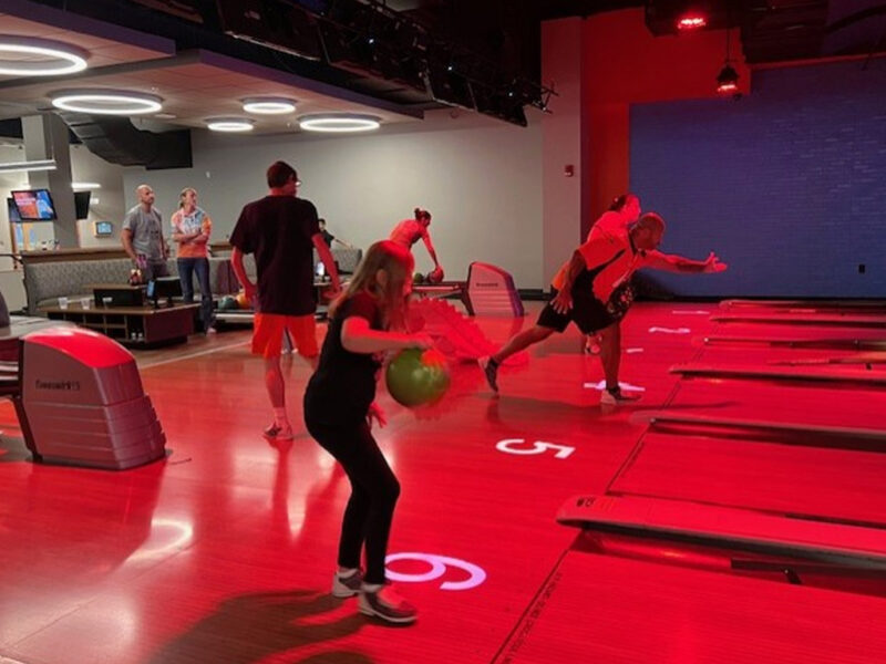 children-bowling a child bowling at a bowling ally.